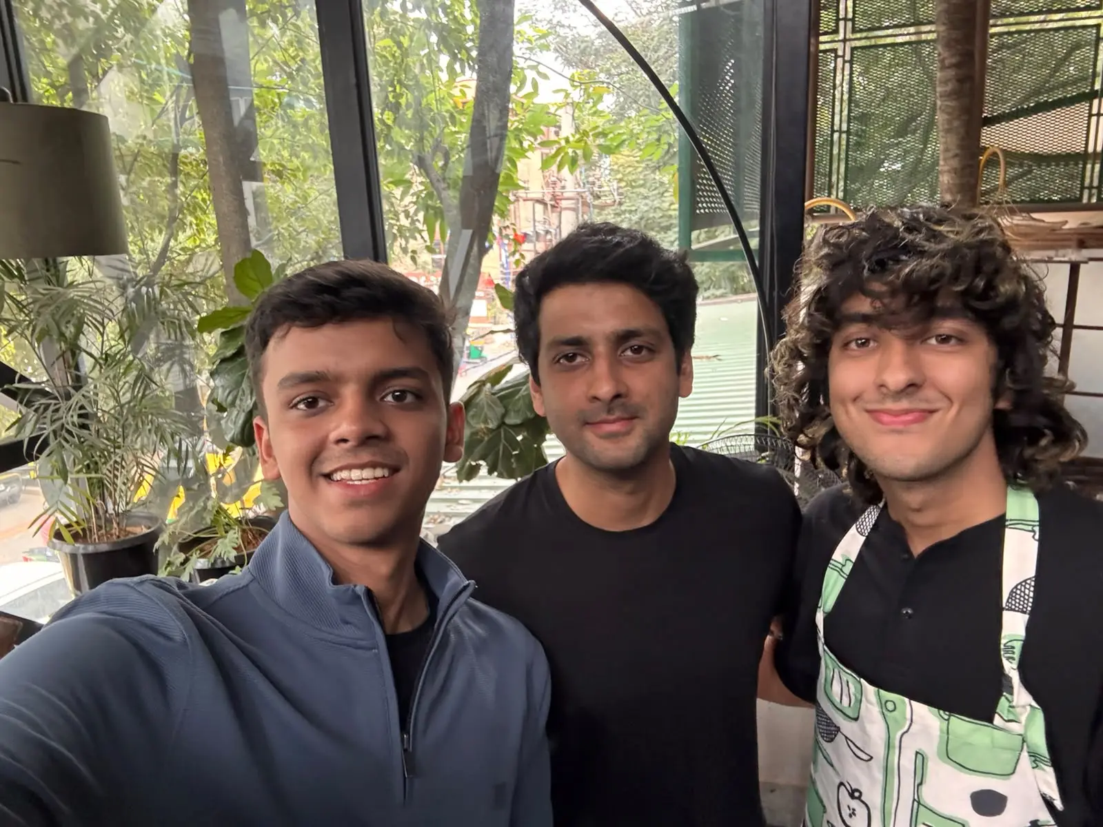Mony and Chaitanya standing with Aryaman at Forge demo day
